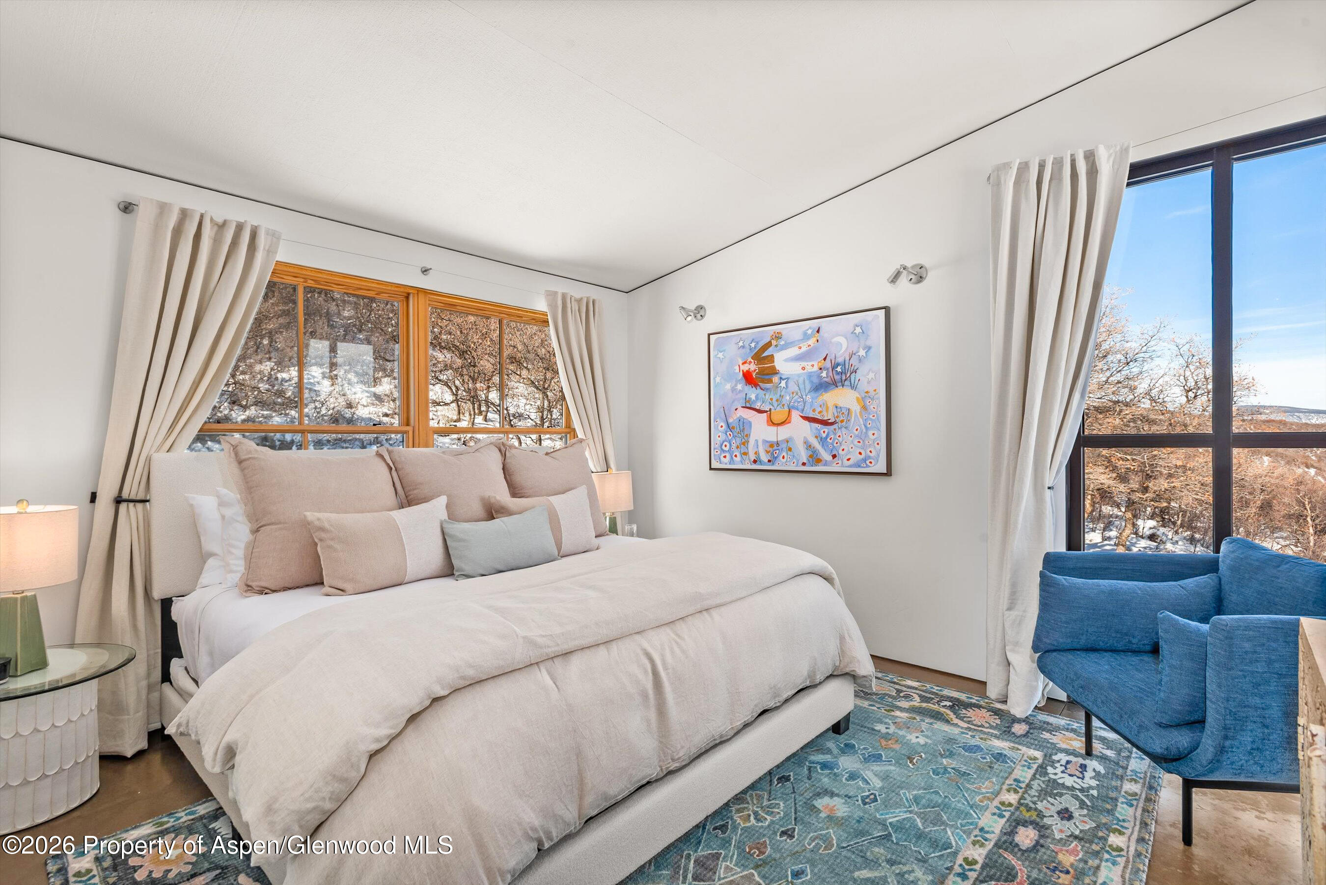 2700 Juniper Hill Road Aspen, CO 81611 - Photo 33 of 39 a bedroom with a bed and glass window