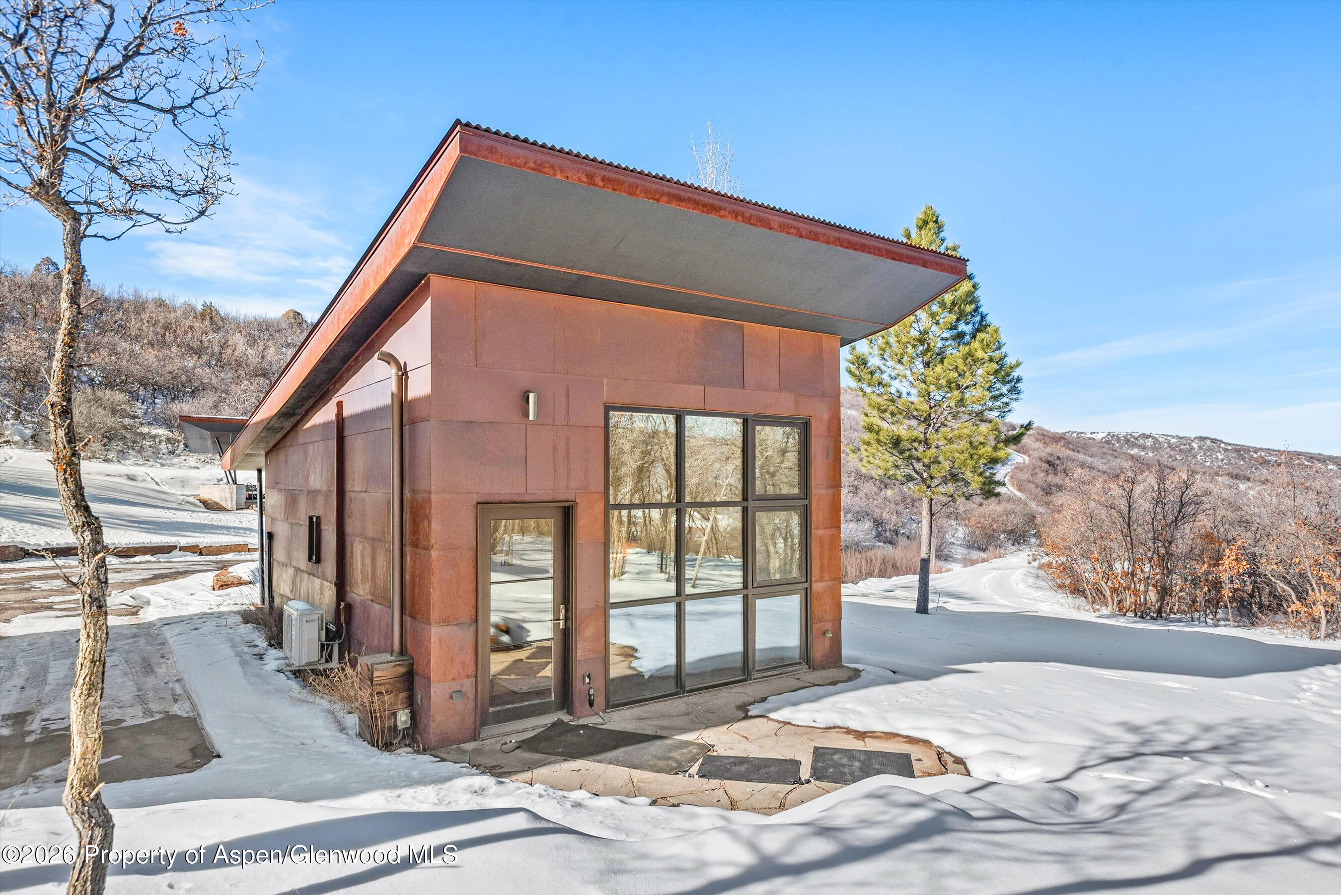 2700 Juniper Hill Road Aspen, CO 81611 - Photo 5 of 39 a front view of a house