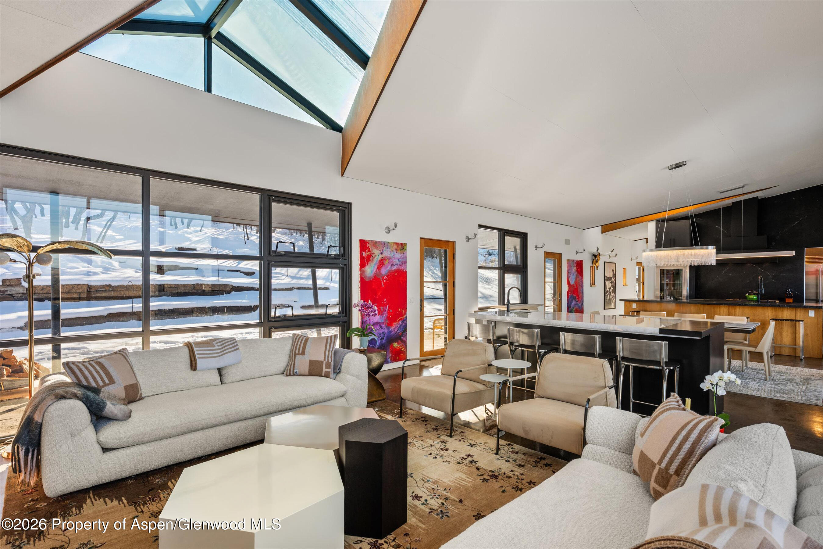 2700 Juniper Hill Road Aspen, CO 81611 - Photo 9 of 39 a living room with furniture kitchen view and a large window