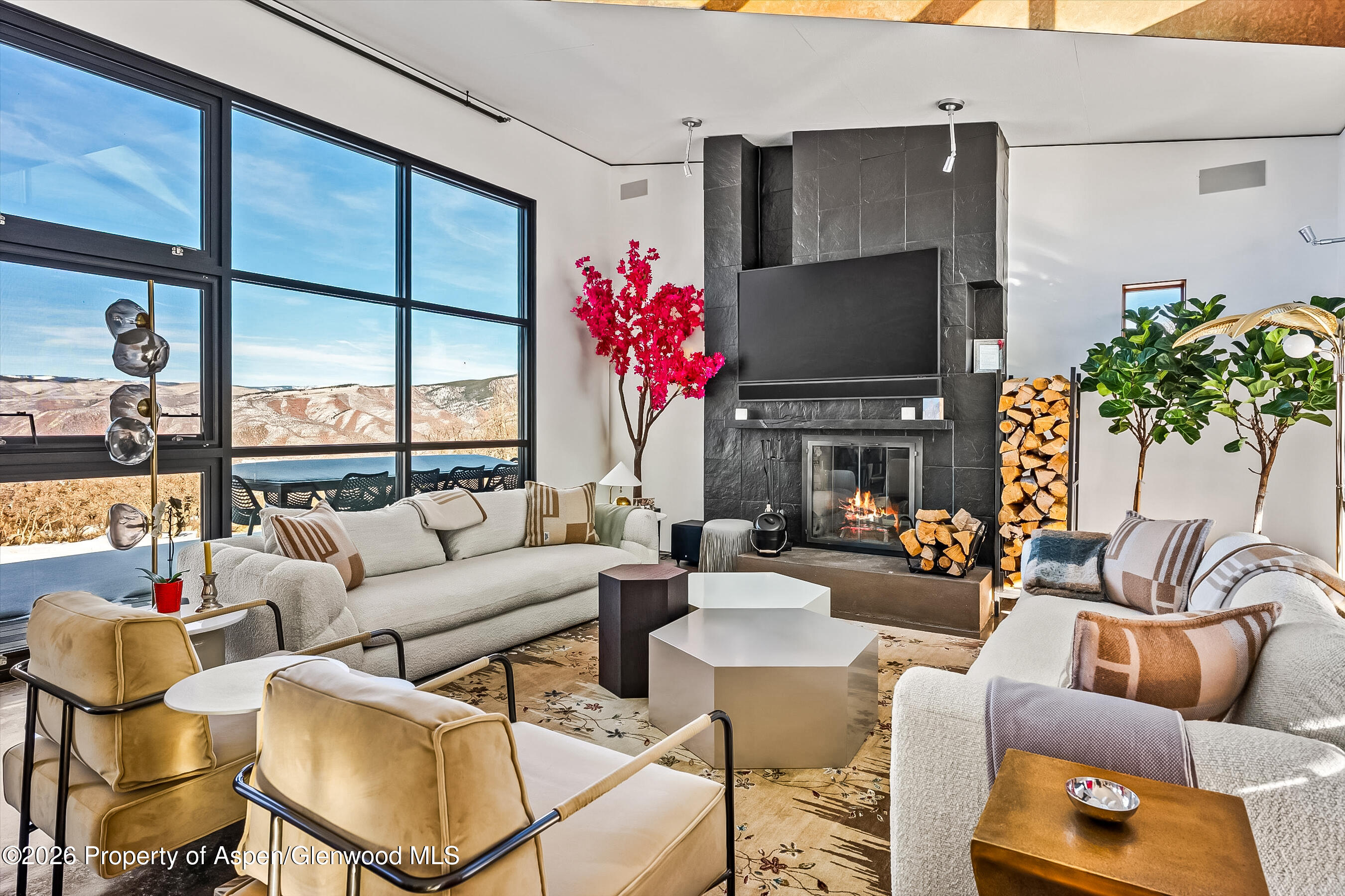 2700 Juniper Hill Road Aspen, CO 81611 - Photo 10 of 39 a living room with furniture and a large window