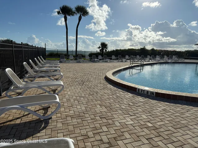 a view of a balcony with furniture