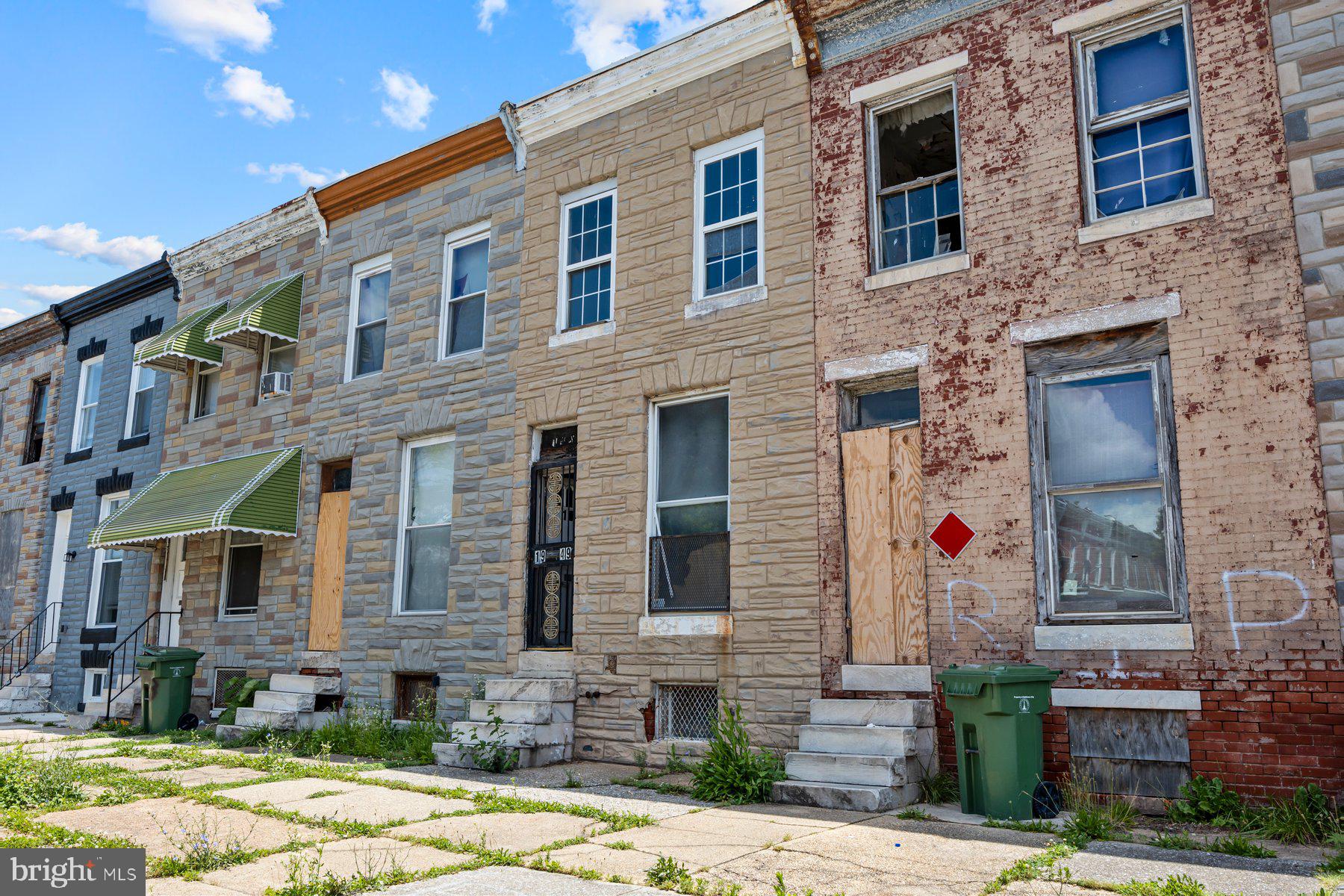 1949 North Collington Avenue Baltimore, MD 21213 - Photo 2 of 5 a front view of a house with a yard