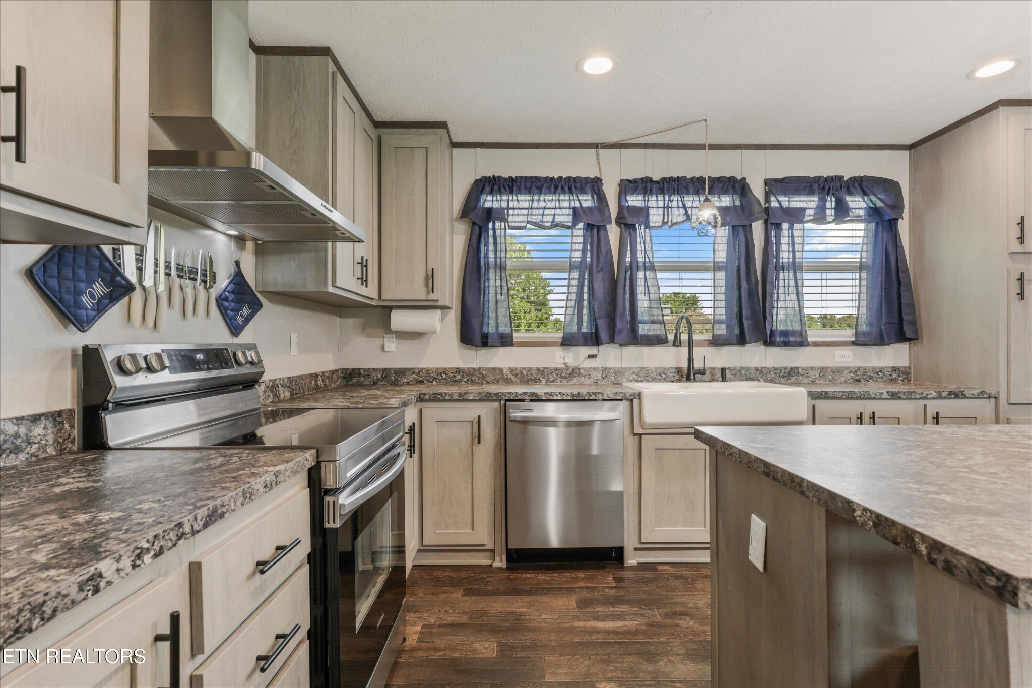 158 Frankfort Road Lancing, TN 37770 - Photo 11 of 46 a kitchen with a sink stove and cabinets