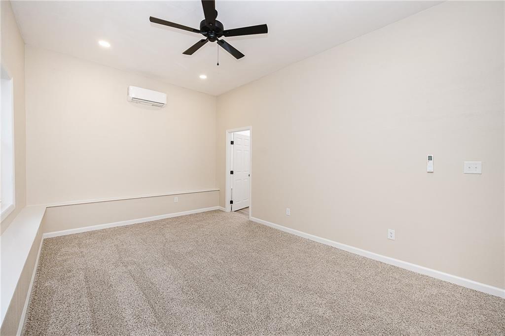 733 Metz Road Indiana, PA 15701 - Photo 12 of 42 an empty room with a ceiling fan and carpet
