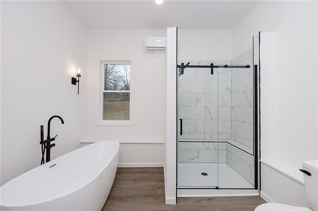 733 Metz Road Indiana, PA 15701 - Photo 15 of 42 a bathroom with a bathtub and a shower