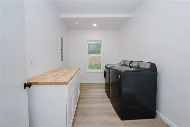 a utility room with washer and dryer