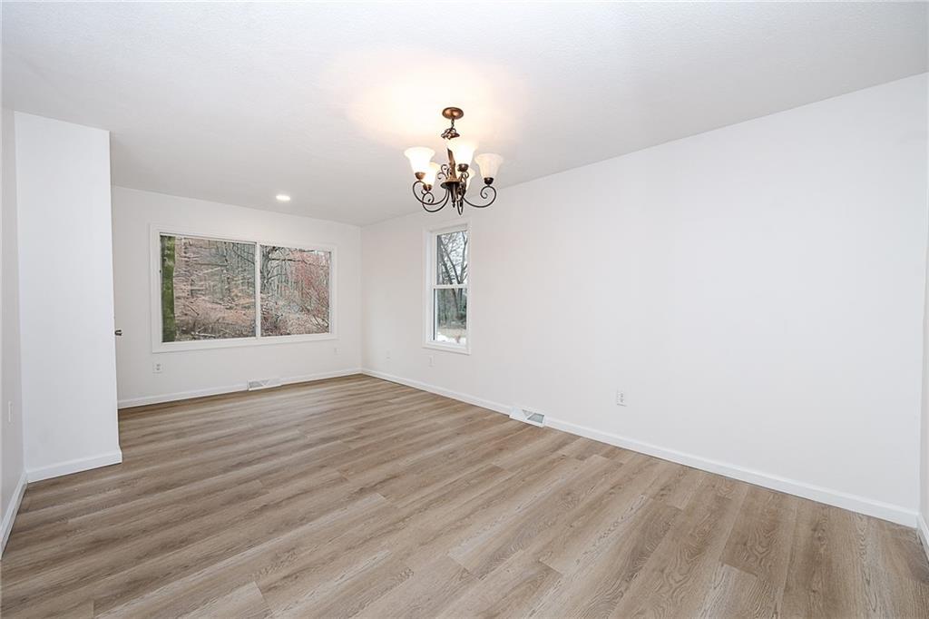 733 Metz Road Indiana, PA 15701 - Photo 2 of 42 wooden floor in an empty room with a window