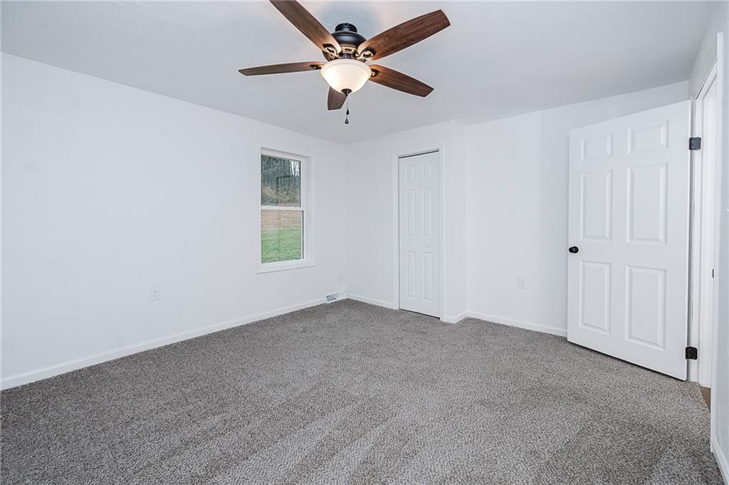 733 Metz Road Indiana, PA 15701 - Photo 22 of 42 an empty room with a window and a fan