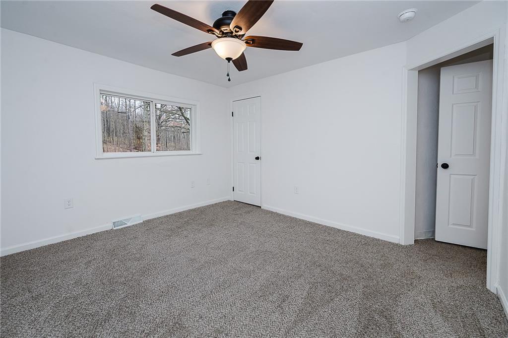 733 Metz Road Indiana, PA 15701 - Photo 27 of 42 an empty room with a window and a fan