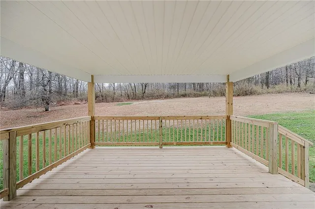 a view of deck with wooden floor and fence