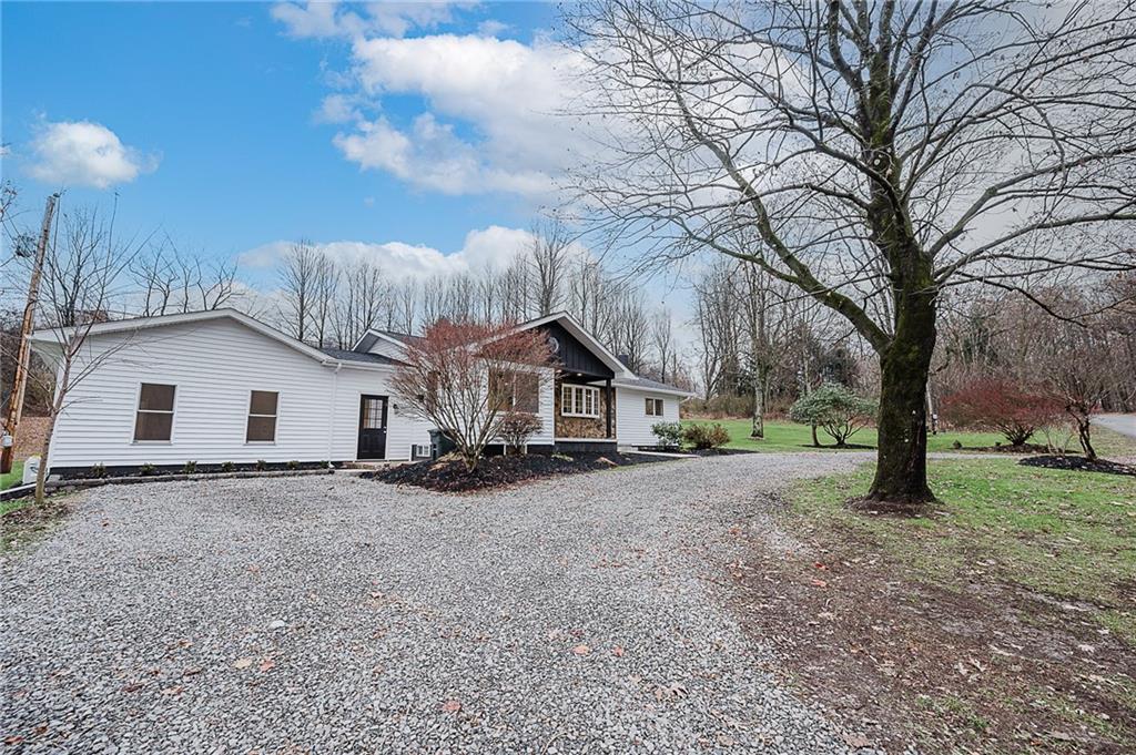 733 Metz Road Indiana, PA 15701 - Photo 37 of 42 a view of a house with a yard covered in the forest
