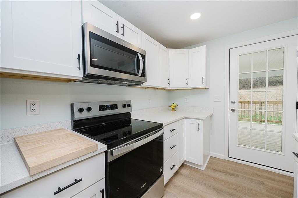 733 Metz Road Indiana, PA 15701 - Photo 8 of 42 a kitchen with a stove and a microwave