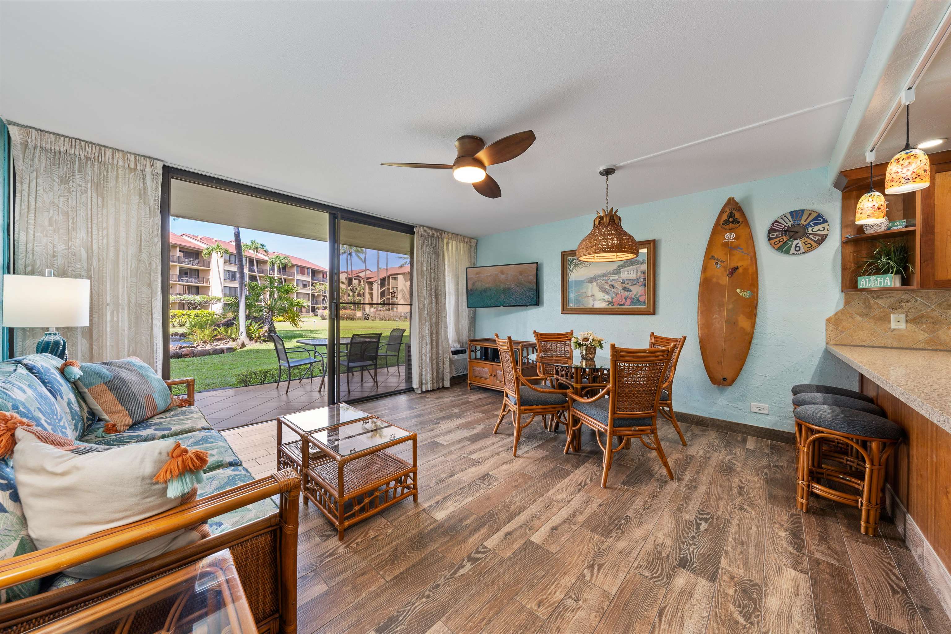 3543 Lower Honoapiilani Road, Unit G103 Lahaina, HI 96761 - Photo 11 of 47 a living room with furniture and a floor to ceiling window
