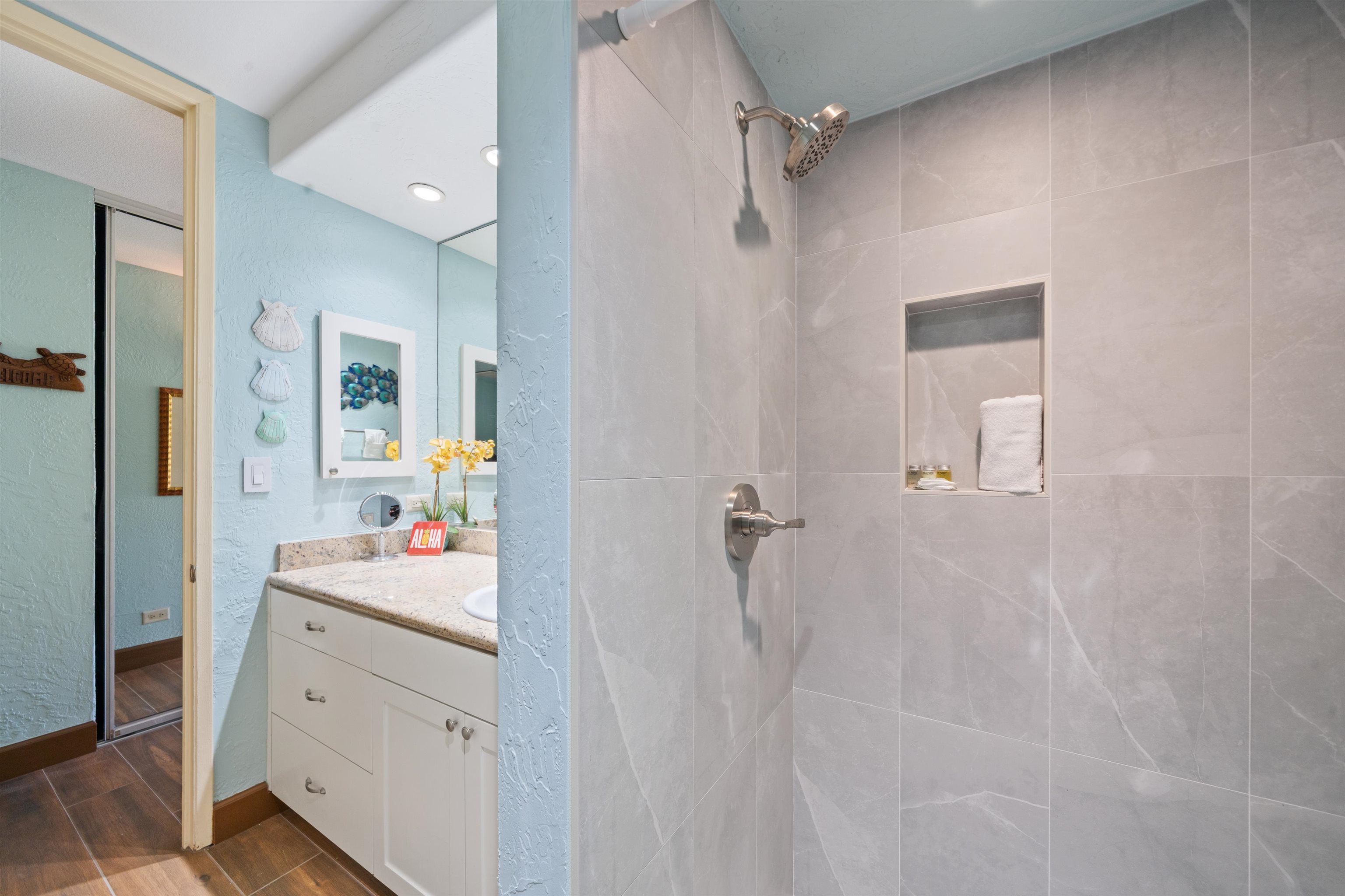 3543 Lower Honoapiilani Road, Unit G103 Lahaina, HI 96761 - Photo 27 of 47 a bathroom with a sink vanity tub and shower