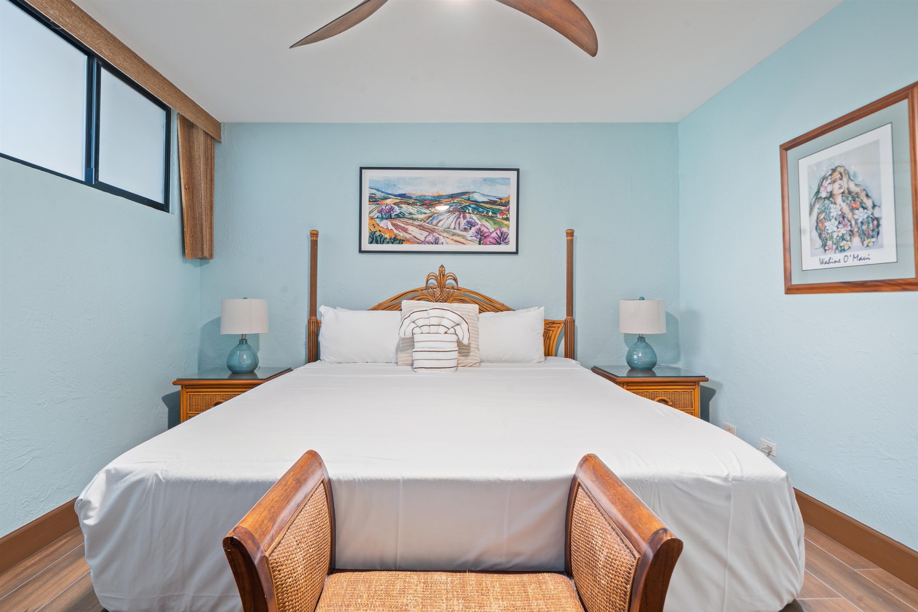 3543 Lower Honoapiilani Road, Unit G103 Lahaina, HI 96761 - Photo 29 of 47 a bedroom with a bed and wooden floor