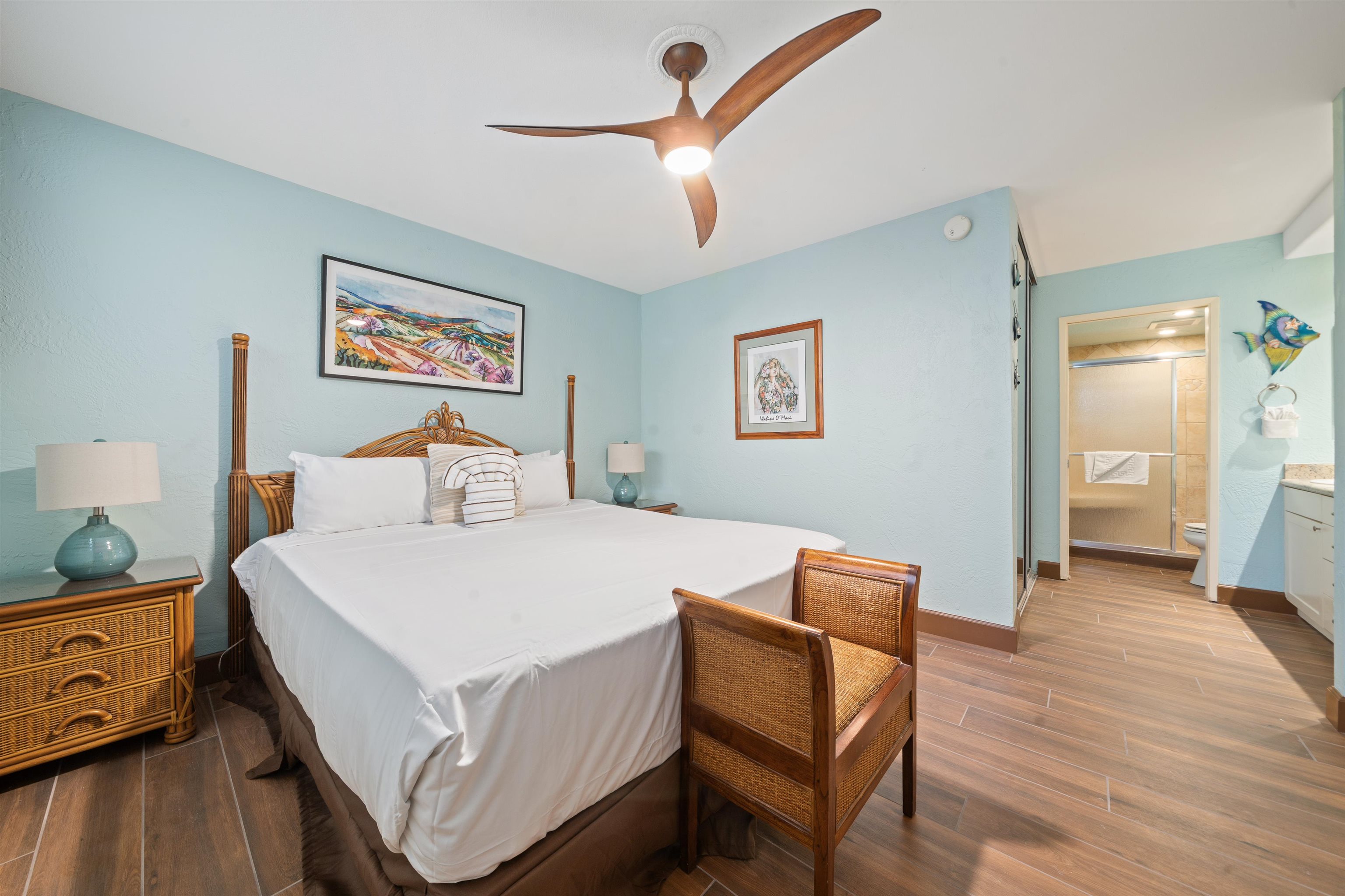 3543 Lower Honoapiilani Road, Unit G103 Lahaina, HI 96761 - Photo 30 of 47 a bedroom with a bed and wooden floor