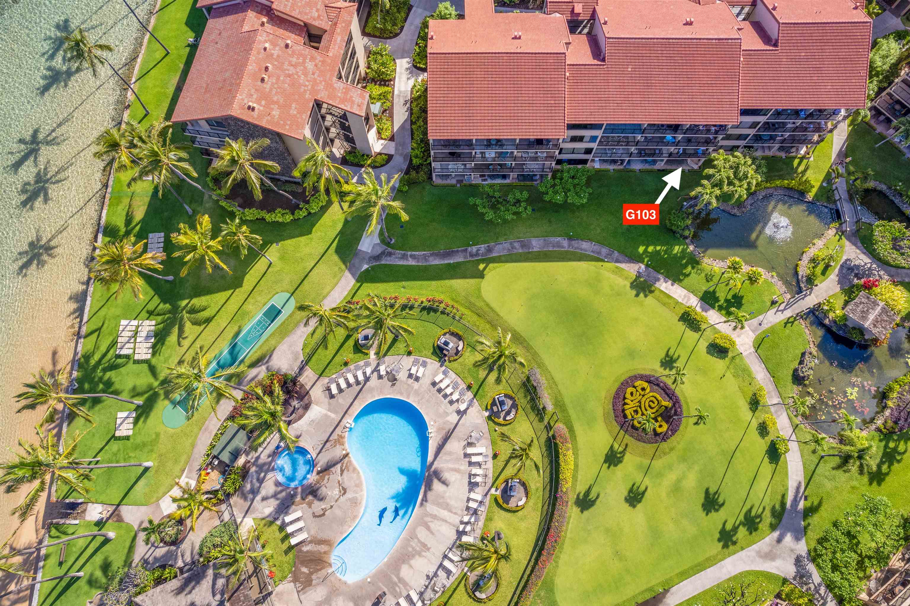 3543 Lower Honoapiilani Road, Unit G103 Lahaina, HI 96761 - Photo 3 of 47 an aerial view of a house with swimming pool and garden space