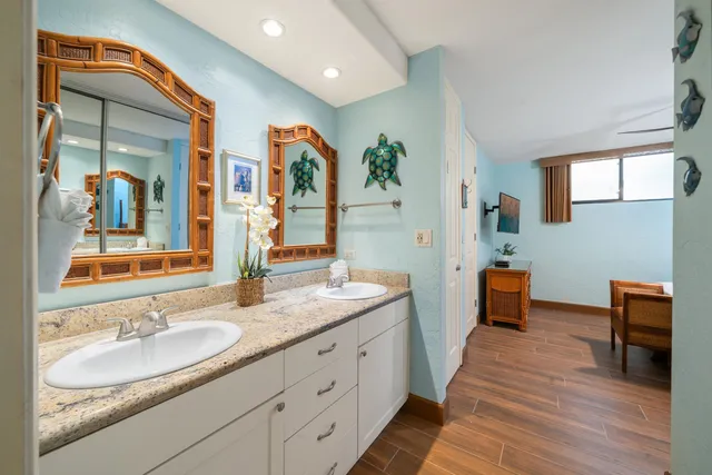 a kitchen with stainless steel appliances granite countertop sink stove and wooden cabinets