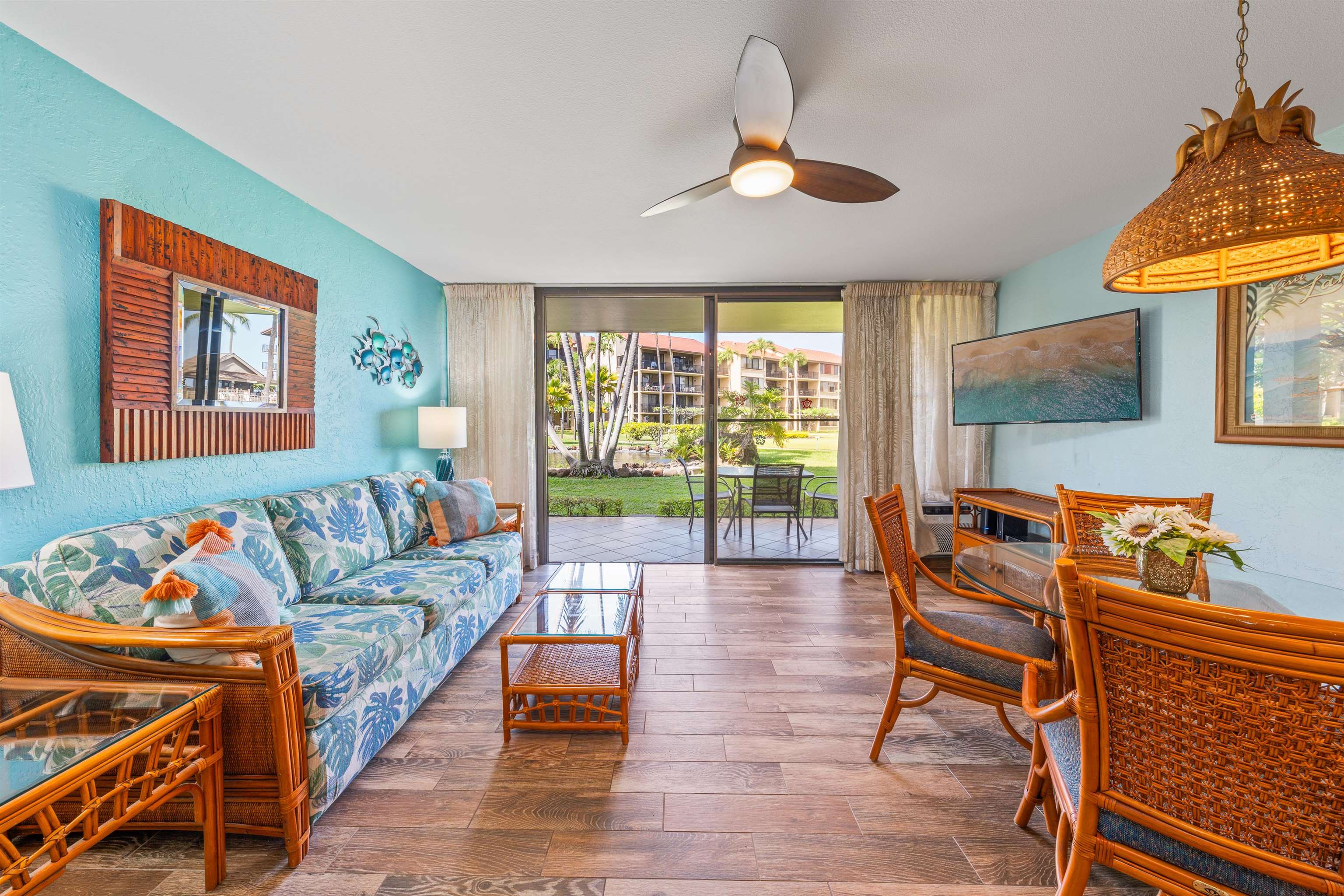 3543 Lower Honoapiilani Road, Unit G103 Lahaina, HI 96761 - Photo 37 of 47 a living room with furniture and a large window