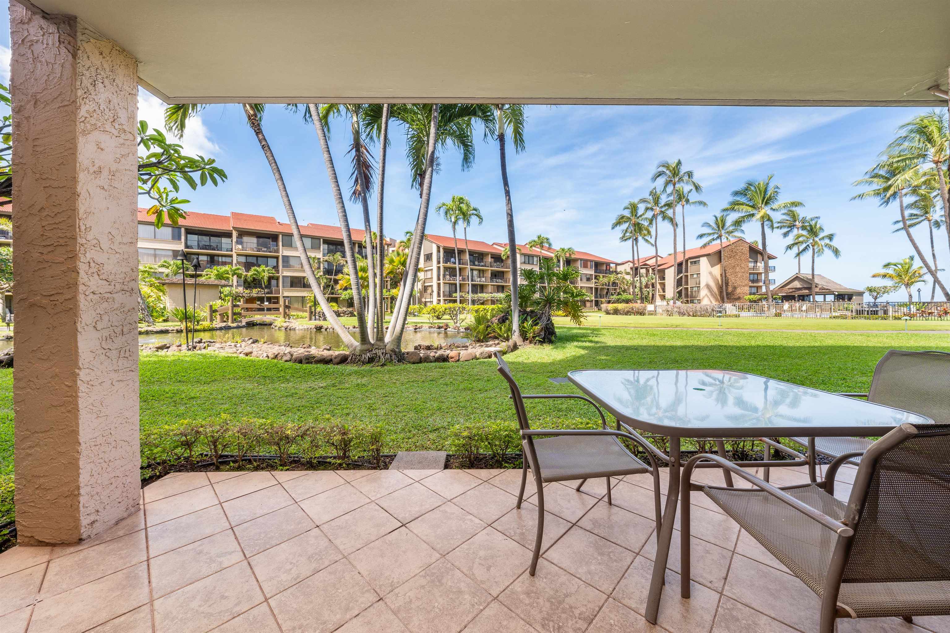 3543 Lower Honoapiilani Road, Unit G103 Lahaina, HI 96761 - Photo 38 of 47 a view of a table and chairs in the patio