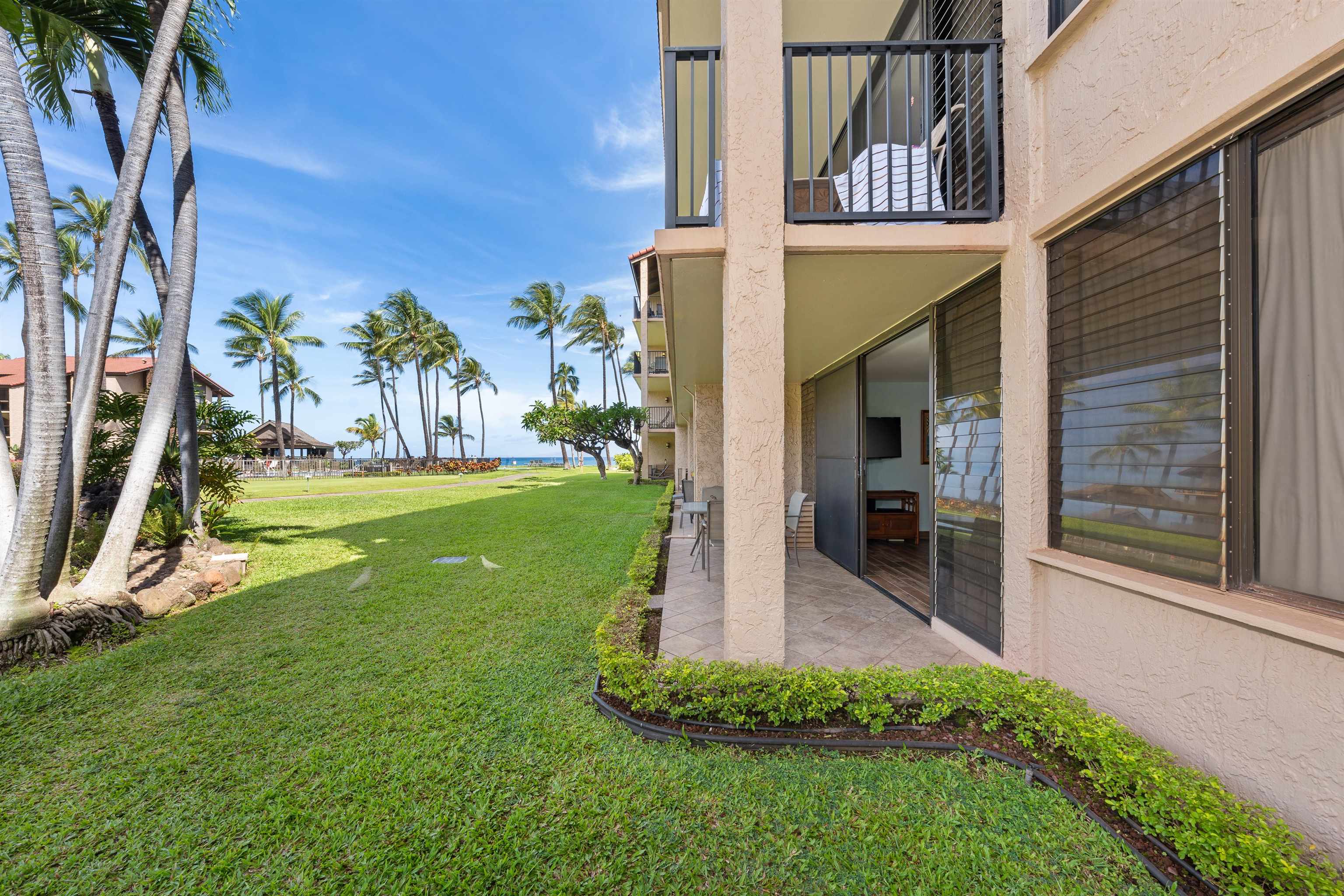 3543 Lower Honoapiilani Road, Unit G103 Lahaina, HI 96761 - Photo 39 of 47 a view of a house with a yard