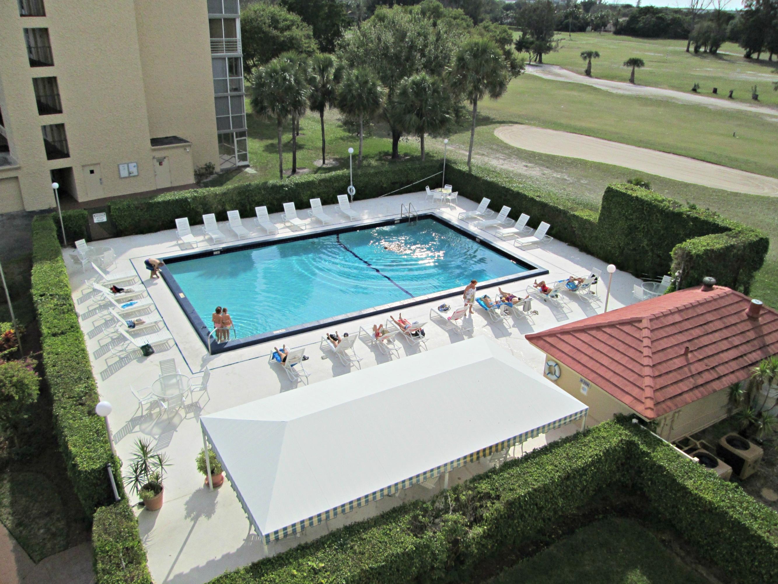 a view of a backyard with sitting area
