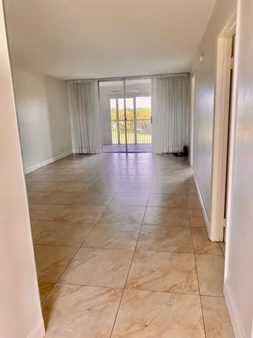 a view of livingroom with an empty space and window