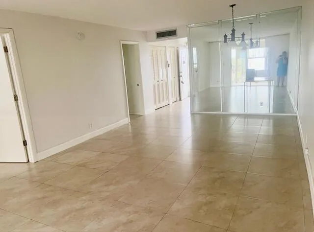 a view of empty room with windows