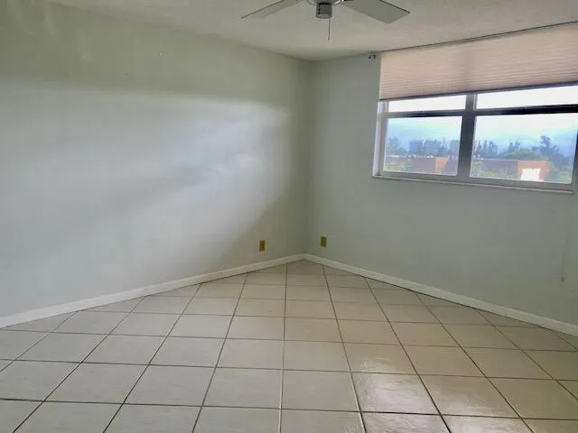 an empty room with a empty space and window