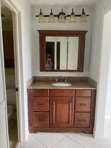 a stove top oven sitting inside of a kitchen
