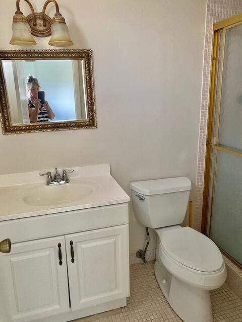 6161 Northwest 2nd Avenue, Unit FOUR Boca Raton, FL 33487 - Photo 32 of 50 a bathroom with a toilet and a sink