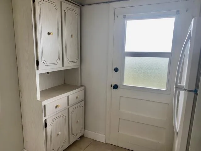 a bathroom with a glass shower door