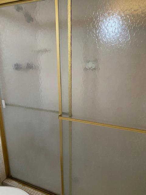 6161 Northwest 2nd Avenue, Unit FOUR Boca Raton, FL 33487 - Photo 34 of 50 a bathroom with a glass shower door