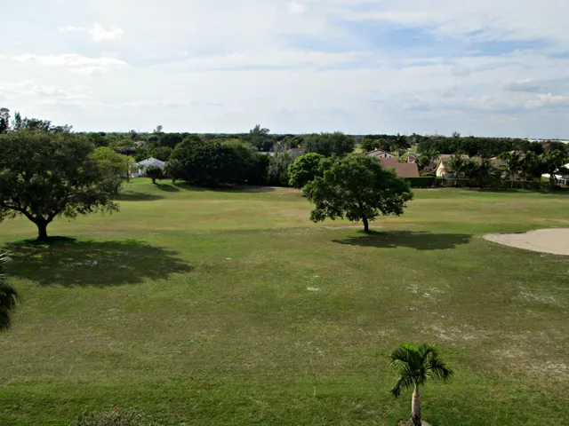 a view of a golf course with a park