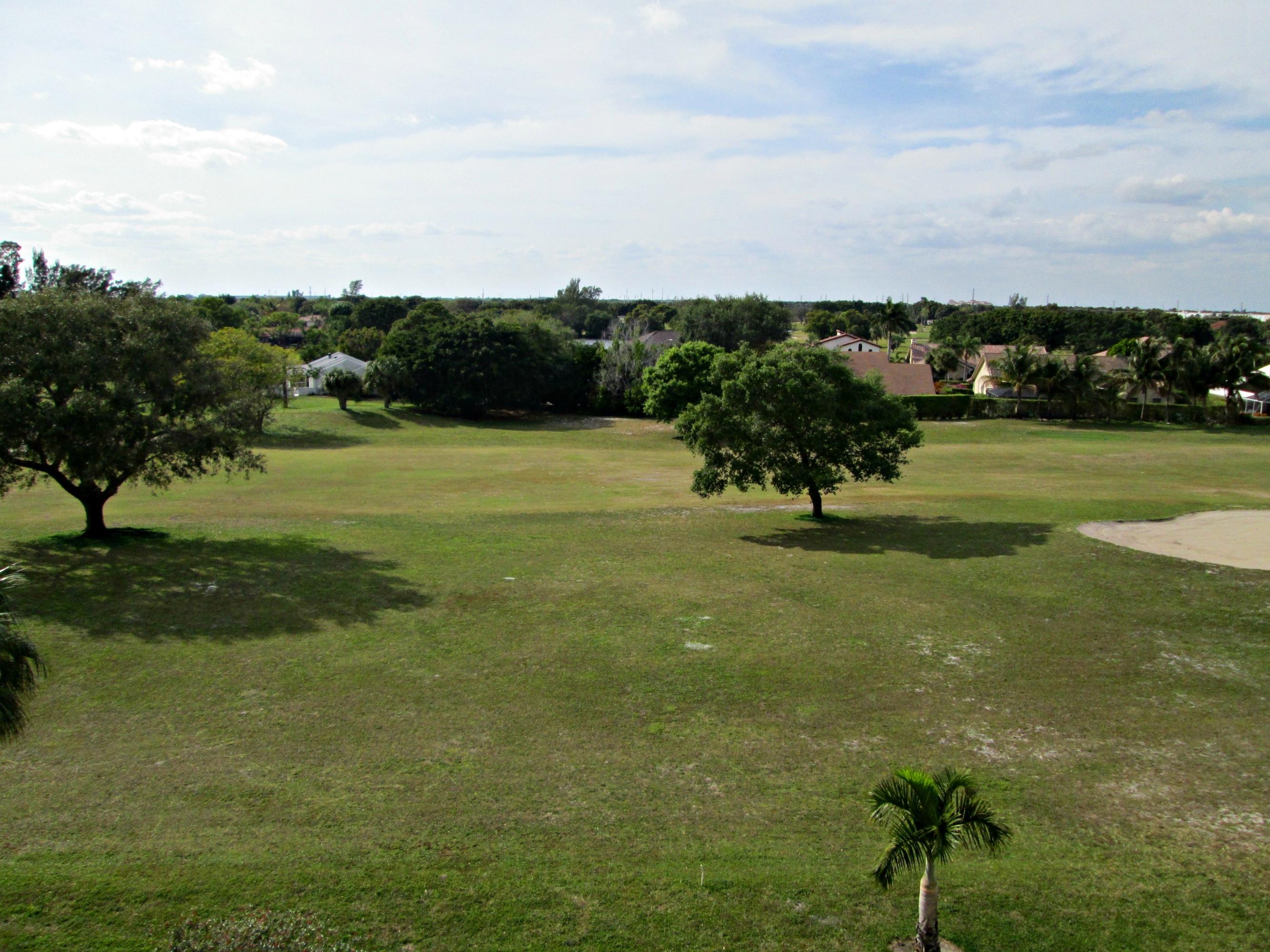 6161 Northwest 2nd Avenue, Unit FOUR Boca Raton, FL 33487 - Photo 7 of 50 a view of a golf course with a park