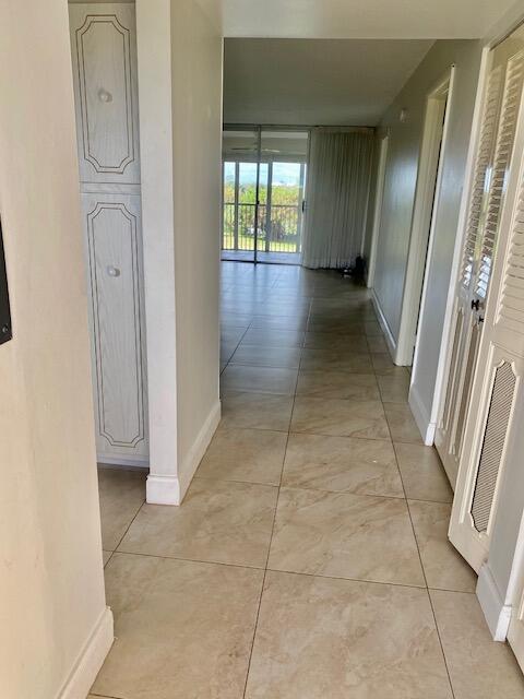 6161 Northwest 2nd Avenue, Unit FOUR Boca Raton, FL 33487 - Photo 10 of 50 a view of a hallway with windows