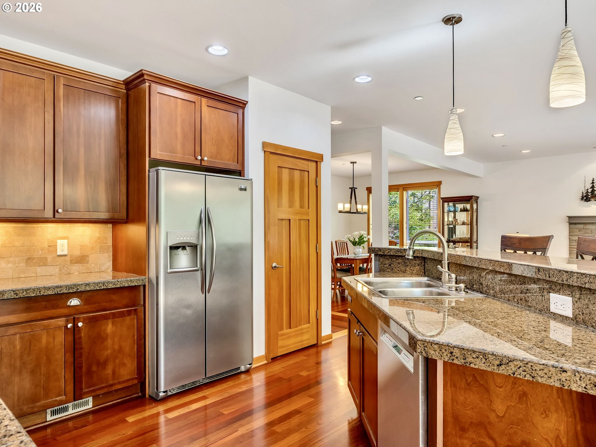 2372 North Fork Road Seaside, OR 97138 - Photo 20 of 48 a kitchen with stainless steel appliances granite countertop a refrigerator a sink and a stove