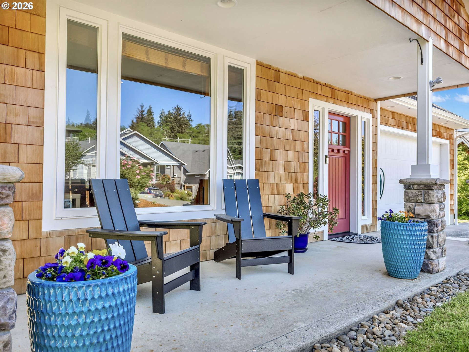 2372 North Fork Road Seaside, OR 97138 - Photo 6 of 48 a living room filled with furniture and a floor to ceiling window
