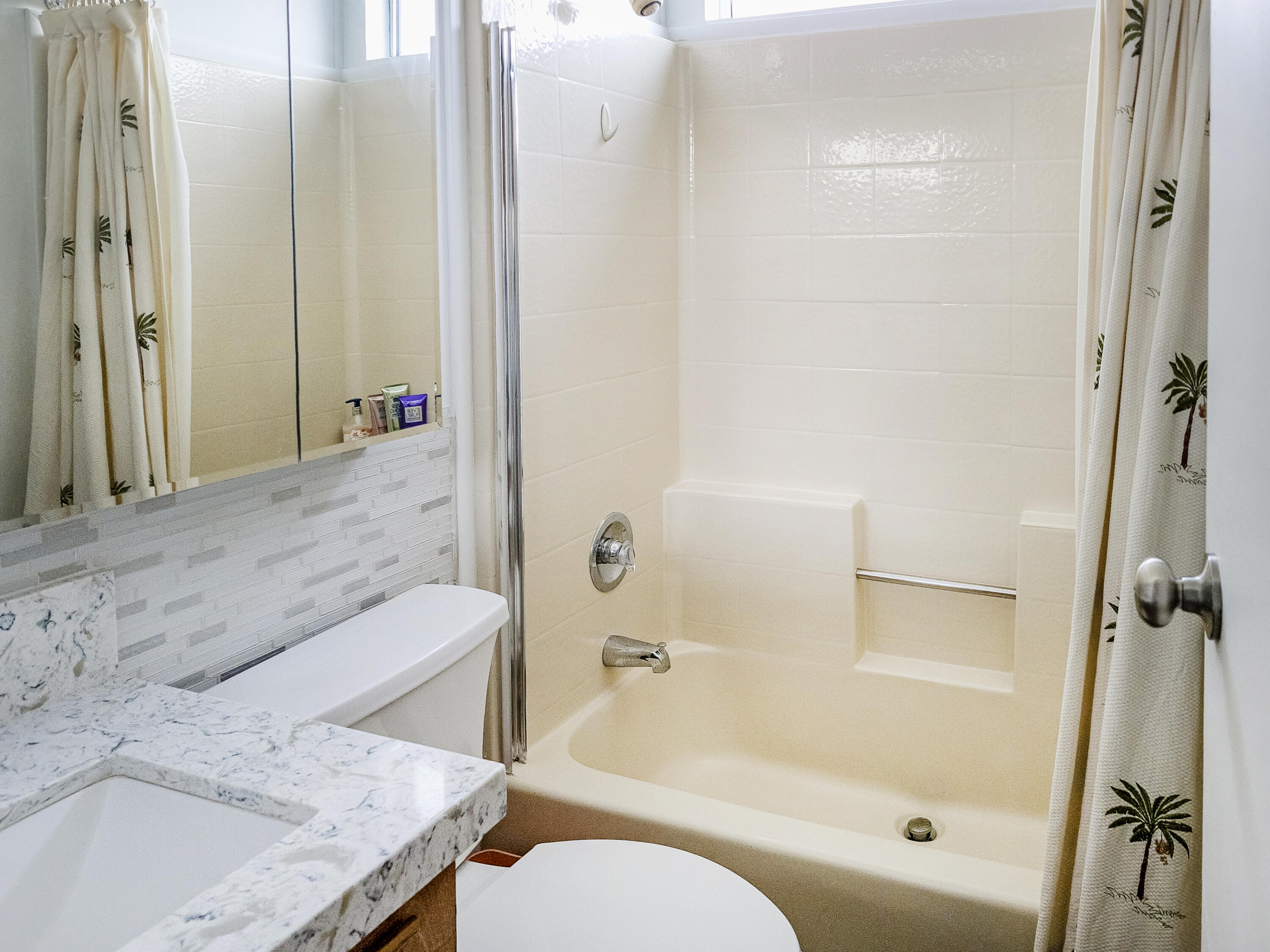 70200 Dillon Road, Unit 160 Desert Hot Springs, CA 92241 - Photo 11 of 31 a bathroom with a granite countertop sink toilet and shower