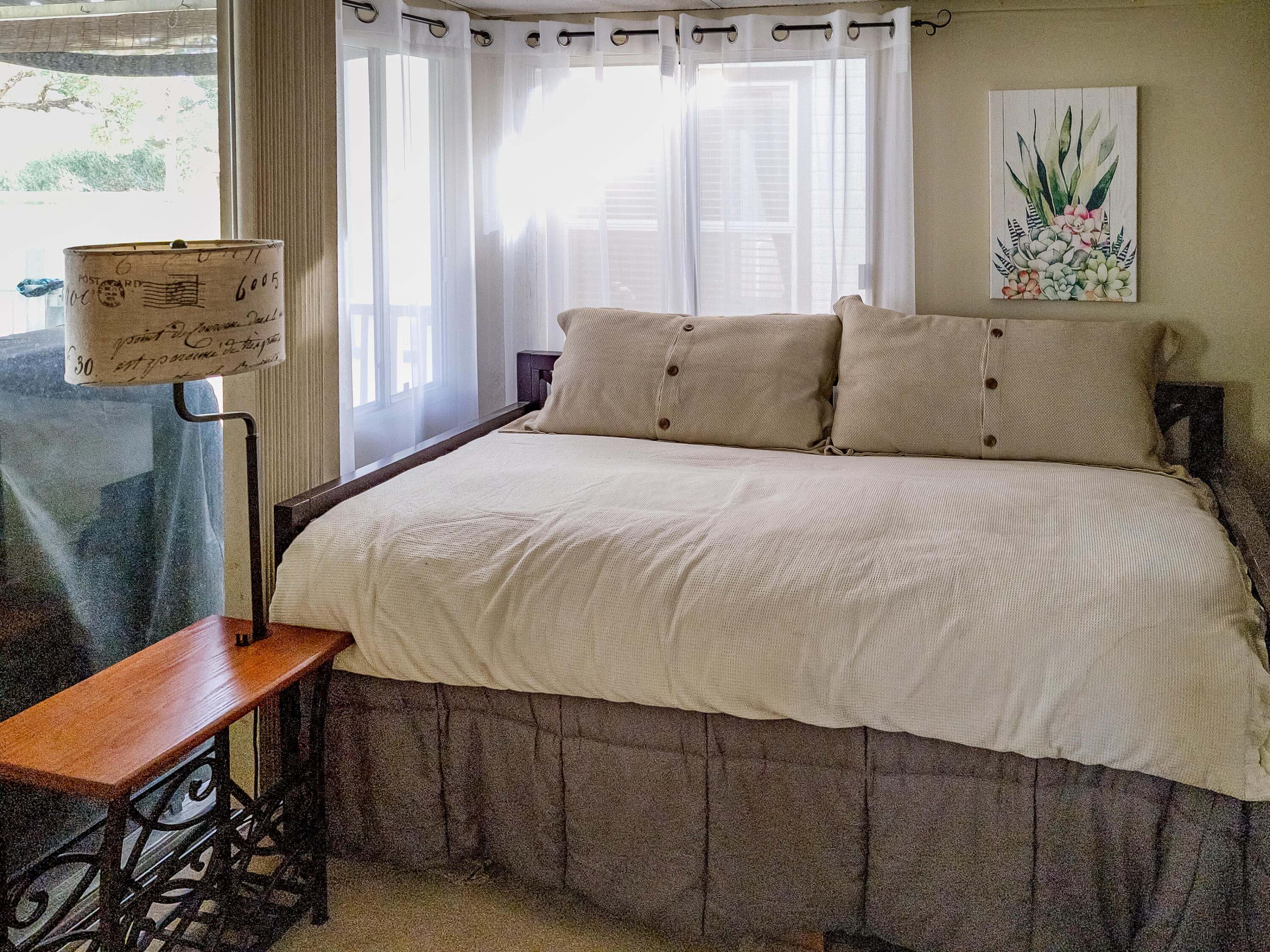 70200 Dillon Road, Unit 160 Desert Hot Springs, CA 92241 - Photo 15 of 31 a bedroom with a bed and wooden floor