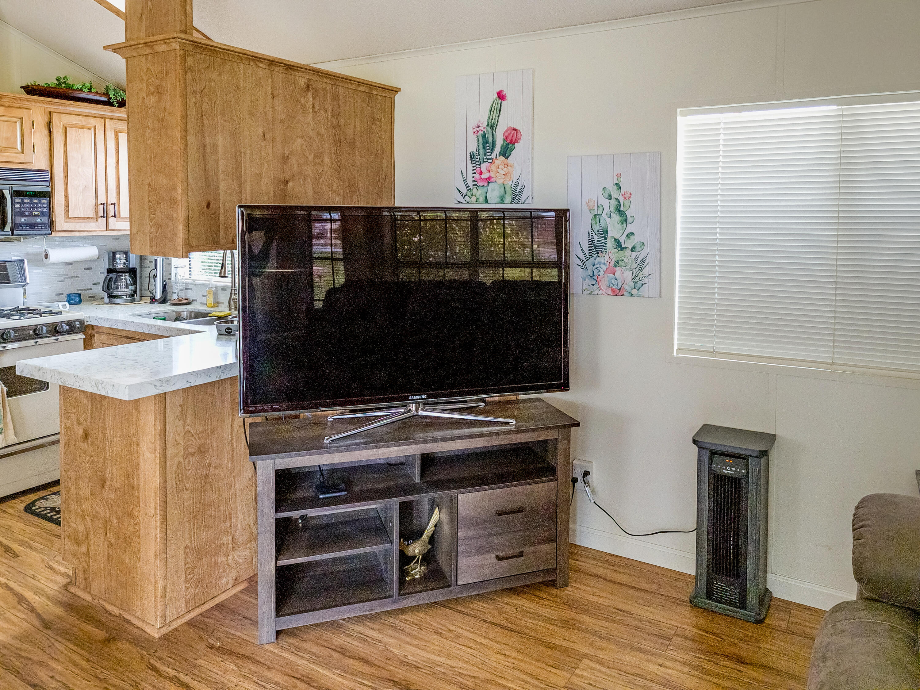 70200 Dillon Road, Unit 160 Desert Hot Springs, CA 92241 - Photo 5 of 31 a kitchen with a stove and a microwave