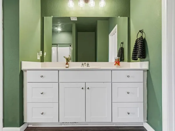 a bathroom with a sink and a mirror