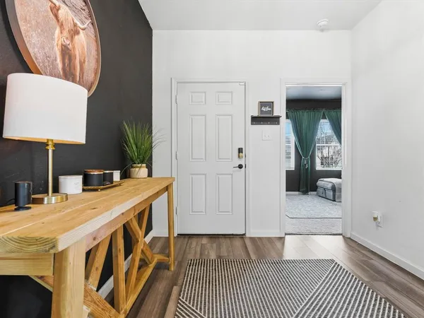a bedroom with furniture and a flat screen tv