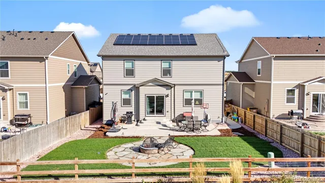 a view of a house with sitting area and furniture
