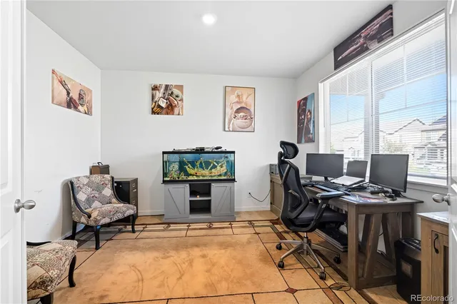 a workspace with furniture and a window