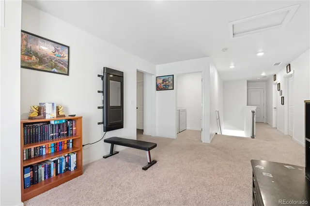 a view of a livingroom with furniture and an empty room