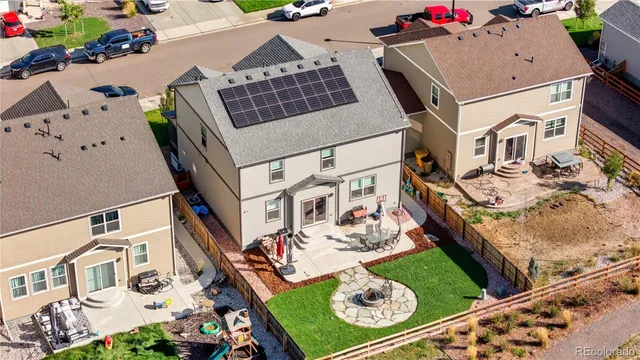 an aerial view of a house roof deck and patio