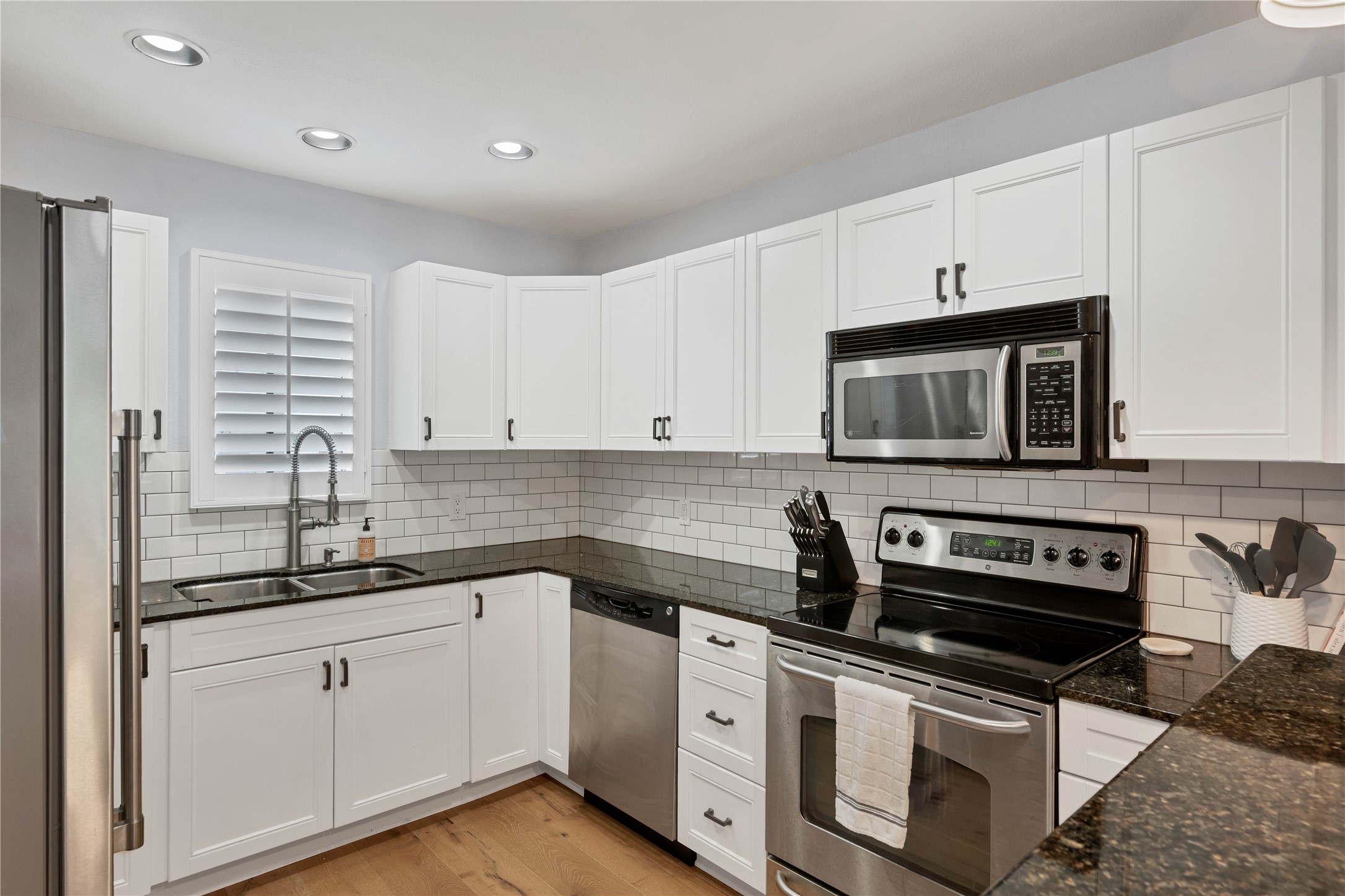 2605 Enfield Road, Unit 221 Austin, TX 78703 - Photo 8 of 30 Great storage and countertop space in this kitchen!