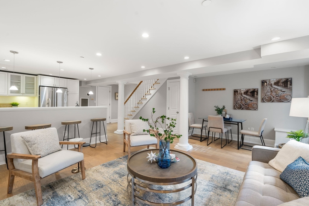 8 Concord Square, Unit 1 Boston, MA 02118 - Photo 2 of 11 a living room with furniture and a dining table