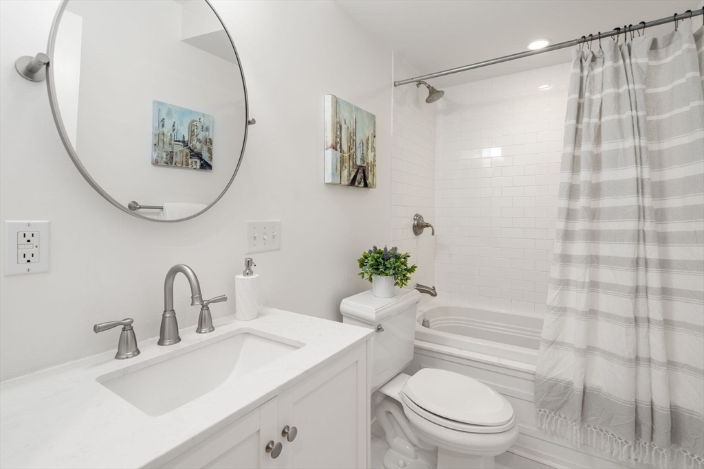 8 Concord Square, Unit 1 Boston, MA 02118 - Photo 8 of 11 a bathroom with a sink toilet and shower